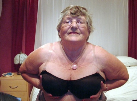 On her bed, obese granny Grandma Libby is naked and she uses a cream to stimulate the vagina.