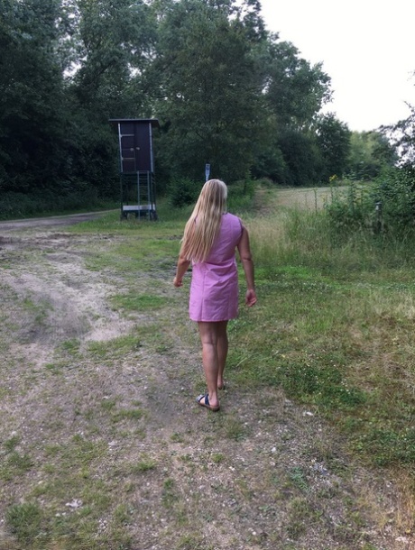 Sweet Susi, an older woman who is a professional and blonde, exposes herself in a country driveway.