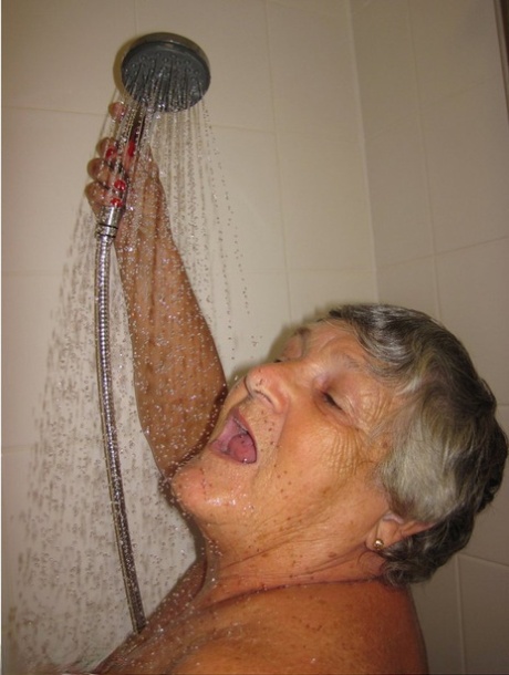 Grandmother Libby and her lesbian partner take turns washing each other in the shower.