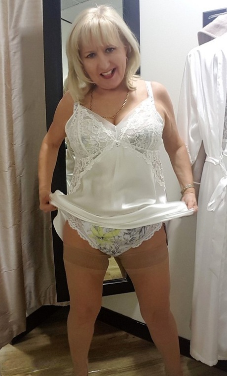 Chubby mature wife Lorna Blu changes form white to red to black sexy lingerie