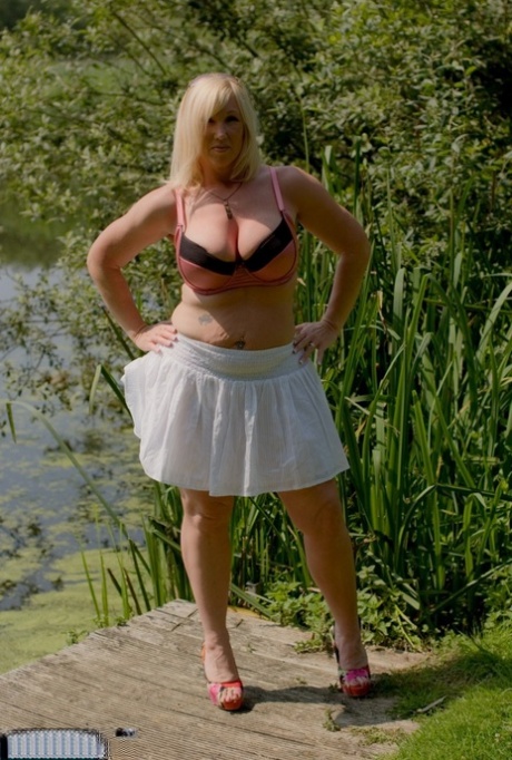 Fat Blonde Woman With Large Breasts Melody Gets Undressed On Lakeside Dock