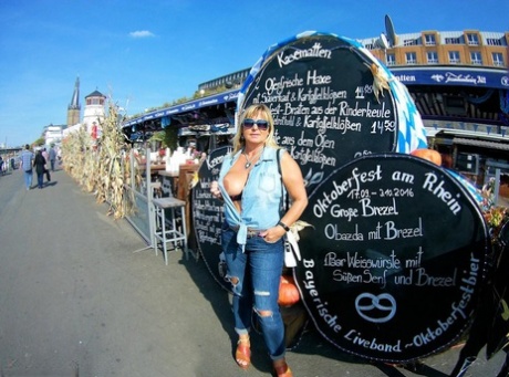 Thick Blonde Serves Beer With Big Boobs Out After Putting In Wood In The Nude