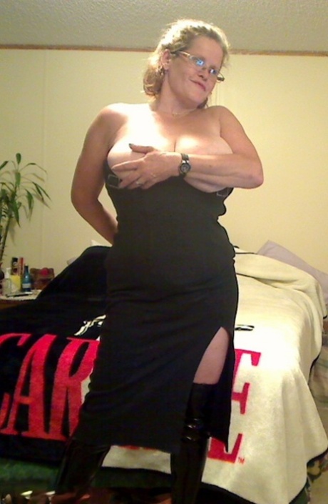 Bigboobs: Redhead amateur Misha MILF, aged 33 (glasses), shows off her large boobs.