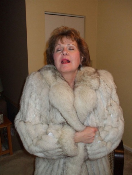 A fur coat and mesh hosiery is used by the first-timer Busty Bliss to give him his blowjob in person.