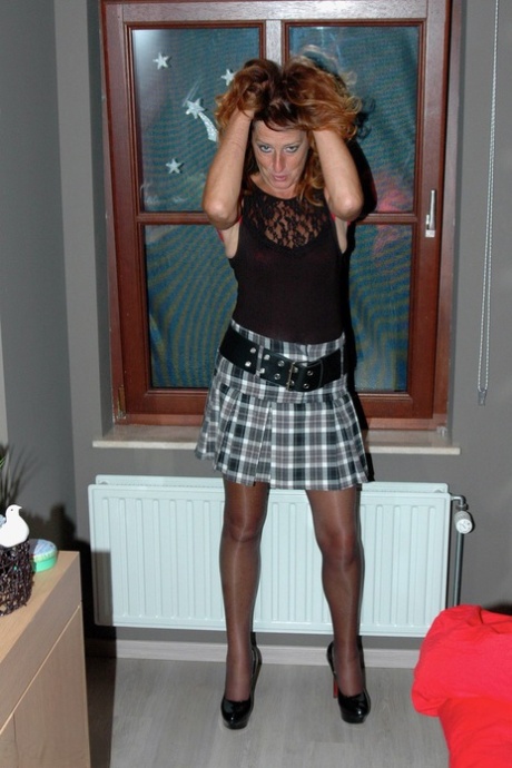 Self-described slutty homemaker dressed in a voluptuous skirt and nylon stockings makes a fashion statement.