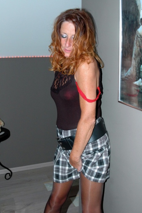 Wearing a seductive skirt and nylon stockings, the lazy homemaker makes a personal appearance.