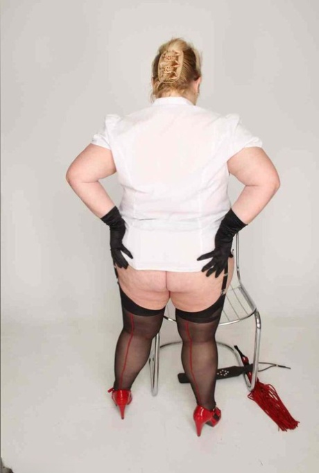 An overweight lad, LexieCummings, wear and hold her own pusses while wearing stockings and red heels.