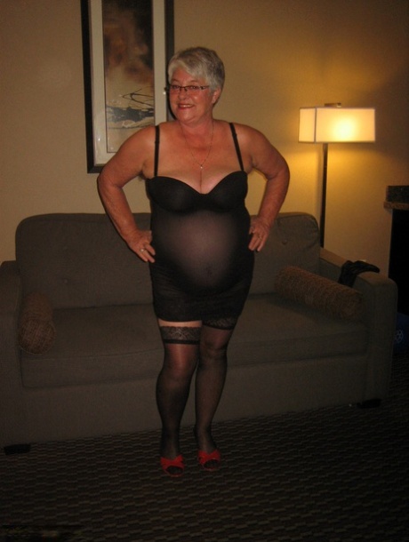 Wearing a pair of tights, the Girdle Goddess is an elderly and inexperienced woman who proudly displays her large breast tissue.