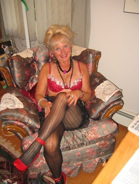 While wearing lingerie and high heels, Ruth in her 20s is a blonde amateur who experiences an orgasm.