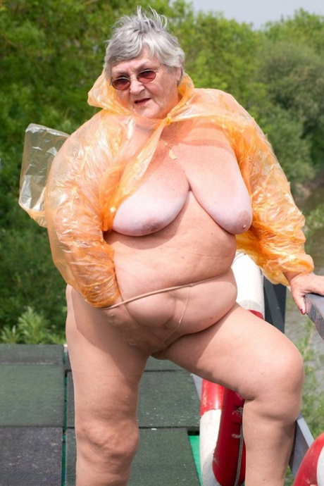 Obese oma Grandma Libby doffs a see-through raincoat to get naked on a bridge #6
