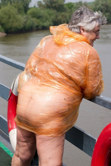 Obese oma Grandma Libby doffs a see-through raincoat to get naked on a bridge #12