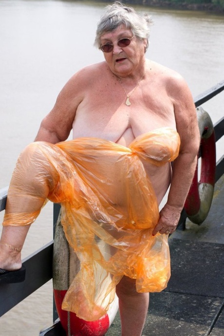 Obese oma Grandma Libby doffs a see-through raincoat to get naked on a bridge Amateur sexy photo #15