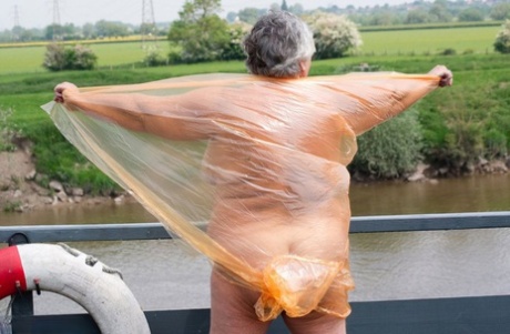 Grandma Libby exposes herself on an open bridge by disguising herself in a transparent raincoat.
