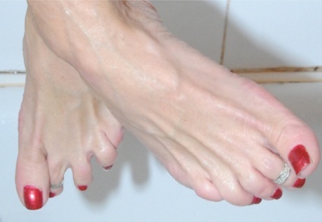 In a busier than life way, Molly MILF is an active toenail painter who shows off some of her painted toenails after she masturbates.