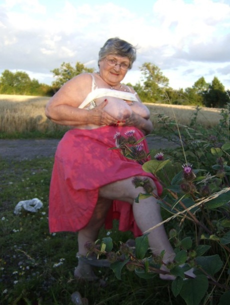 Obese Oma Grandma Libby Exposes Her Huge Ass While In A Field By A Rural Road