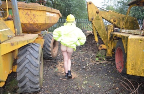 Exposed Barby Slut exposes herself on heavy equipment at a job site, as shown in this video of amateur barbies getting naked.