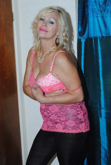 While participating in a SFW event, over 30 amateur Platinum Blonde removes her leather pants.