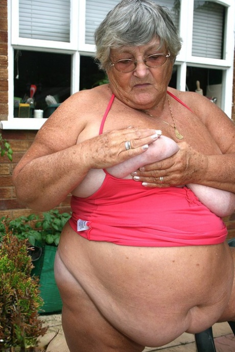 Grandma Libby, the overweight woman from Brooklyn, performs an abdominal kiss before resting on a patio to release her large ass.