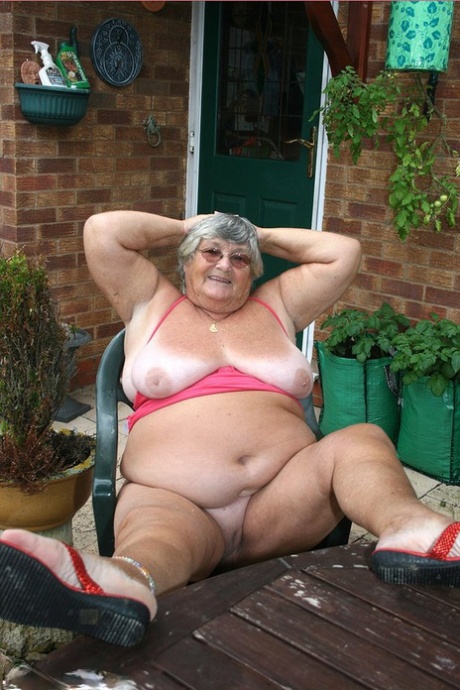 Big aspiration: Grandma Libby proudly shows off her fat face by performing fellatio on the backside of an outdoor patio, before unleashing herself on a long climb up and down to reveal her big ass.