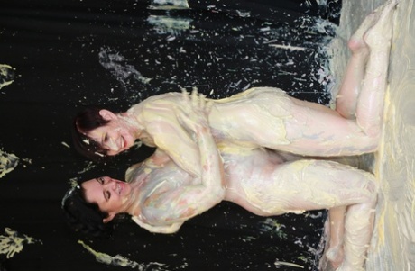 Body paint is used by Zander Lee and her lesbian partner to cover their bodies.