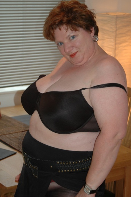 Before releasing the cunt, Chris 44g, an overweight redhead, displays her large breast area.