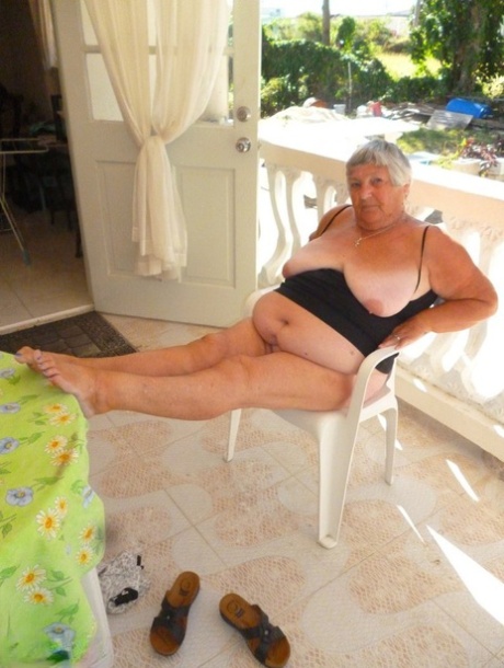 Grandma Libby, who is fat and overweight, appears to be naked on the balcony alone.