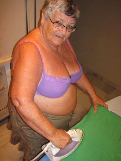 British oma, Grandmother Polly (pictured), flaunts her chest while ironing due to being overweight.