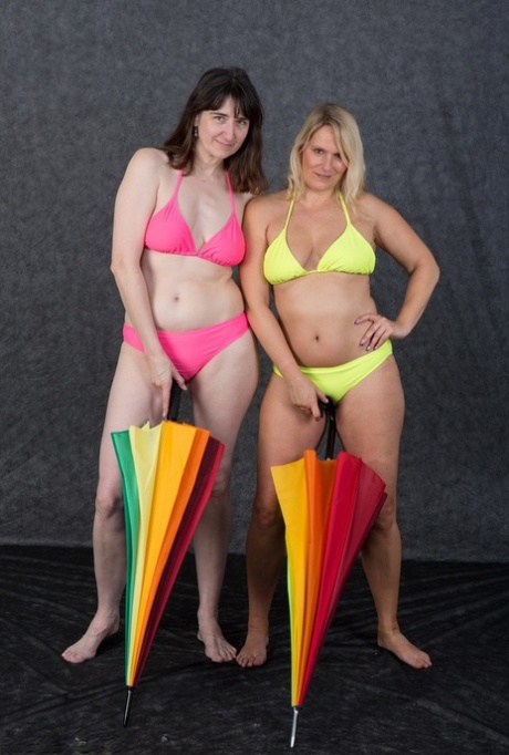 Short hair: The bikinis are taken off the body of a blonde amateur girl, Sweet Susi, left, and her lesbian lover, right.