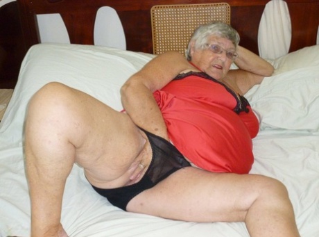 Old British woman Grandma Libby removes lingerie while toying her snatch