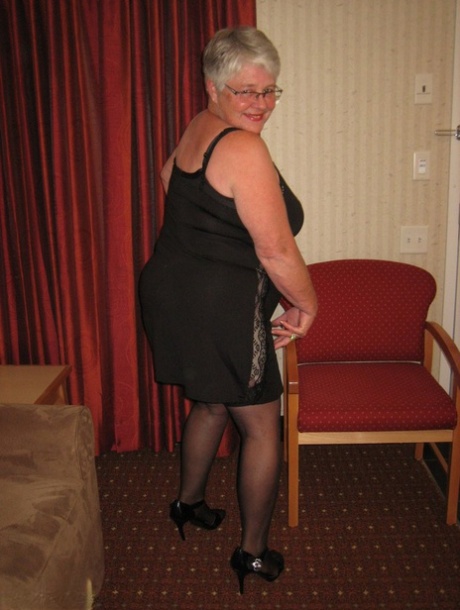 An upskirt for the Fat Girdle Goddess is available in a black slip and girdle with no panties.
