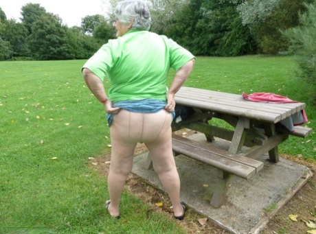 Obesity: Grandma Libby, who is 80 years old, exposes her large tits and buttocks on a picnic table.