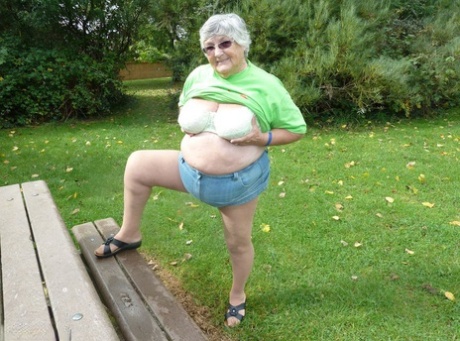 The large tits and buttocks of Grandma Libby are exposed on a picnic table.
