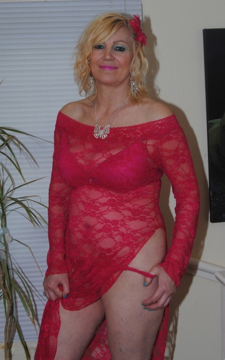 Mature Sexy Platinum Blonde Pulls Down Red Lace Dress To Expose Big Saggy Tits