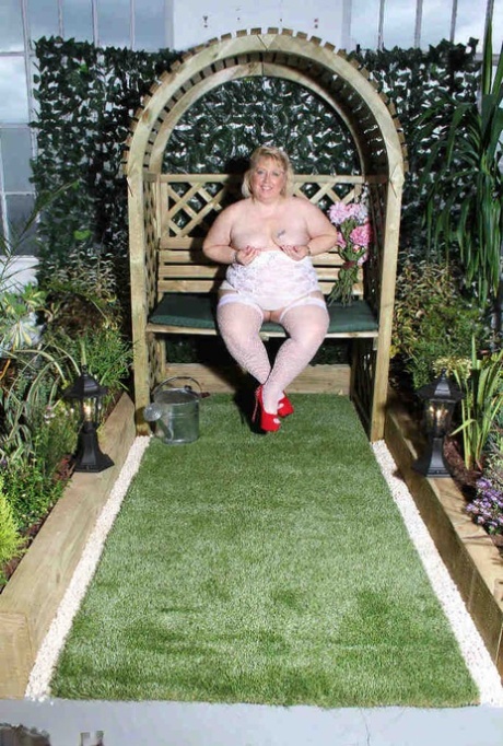 A garden is the location where Lexie Cummings, a full-figured blonde, uses her tiny pussy for a dildo in an intimate moment.