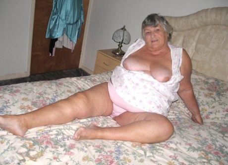 Gracias: Old woman Grandma Libby, pictured in the photo with her large roll of fat after she stripped off and got naked on a bed.