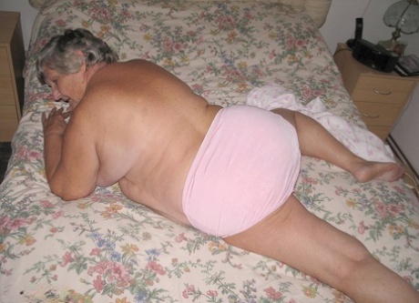 Ungar woman: Grandma Libby, aged 80, takes a deep nap after getting up on a bed naked and carrying her fat roll to her body.