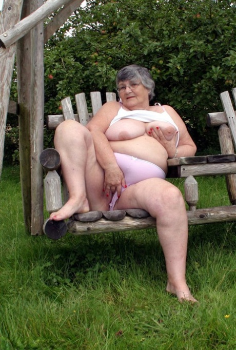 The breasts of Grandma Libby, an elderly British woman, are showcased on a bench in the backyard.