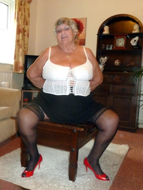 Obese oma Grandma Libby uncovers her large boobs in her underwear and hosiery