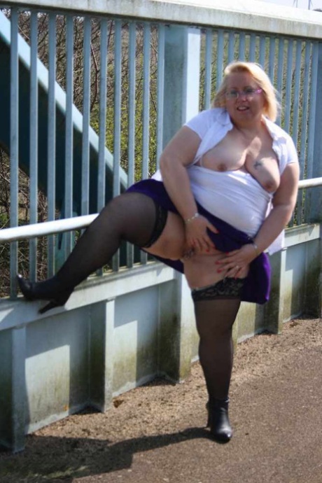 A footbridge is crossed by Lexie Cummings, an obese British amateur, who poops.