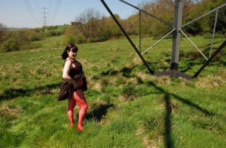 Juicey Janet, a UK amateur, is seen naked and in heels beneath a hydro tower.
