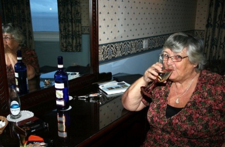 Prior to vaginal intercourse, Grandma Libby from the UK consumes an alcohol bottle.