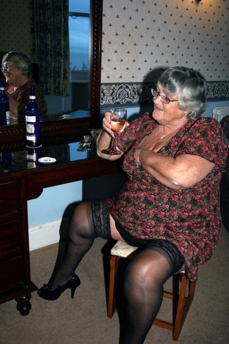 Prior to a vaginal incision, Grandma Libby from the UK drinks alcohol by pouring it on a bottle.