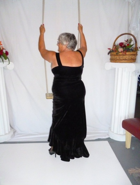 A naked version of Grandma Libby in stockings, dressed in a black dress, is shown.