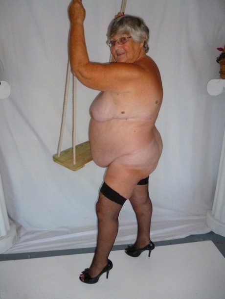 In revealing clothing, Grandma Libby exposes her stockings in a black dress.