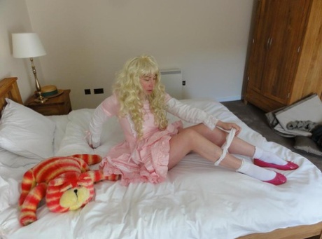 A cosplay outfit is worn by Barby Slut, an older blonde woman, who then displays her pussy.