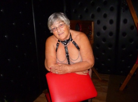 Old BBW Grandmother Libby is in a dungeon and finds herself in stocks.