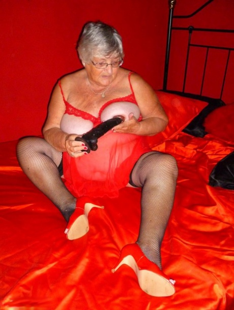 Grandmother Libby, who is elderly, uses a bed to dildo her freshly razored vagina.