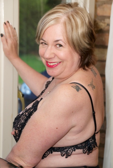 Overweight mature woman Speedy Bee dresses in 3 piece lingerie.