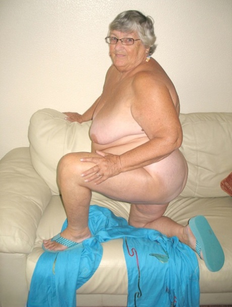 Following the removal of her bare breasts, Grandma Libby, who is now an adult, uses both hands to stroke and perform oral sex on her chest.