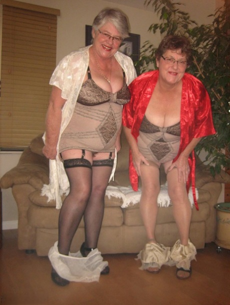 A girdle goddess and another N (male) model wear matching nylon lingerie.